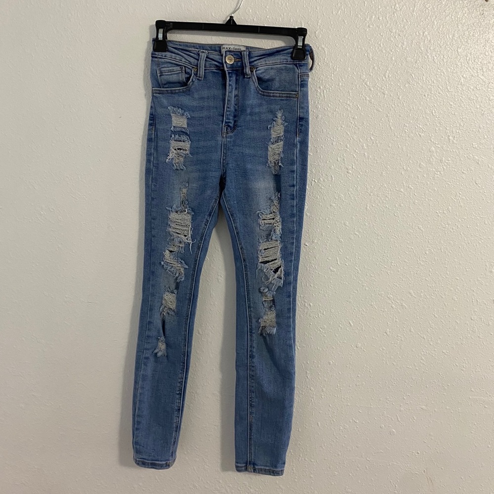 Distressed light blue denim jeans